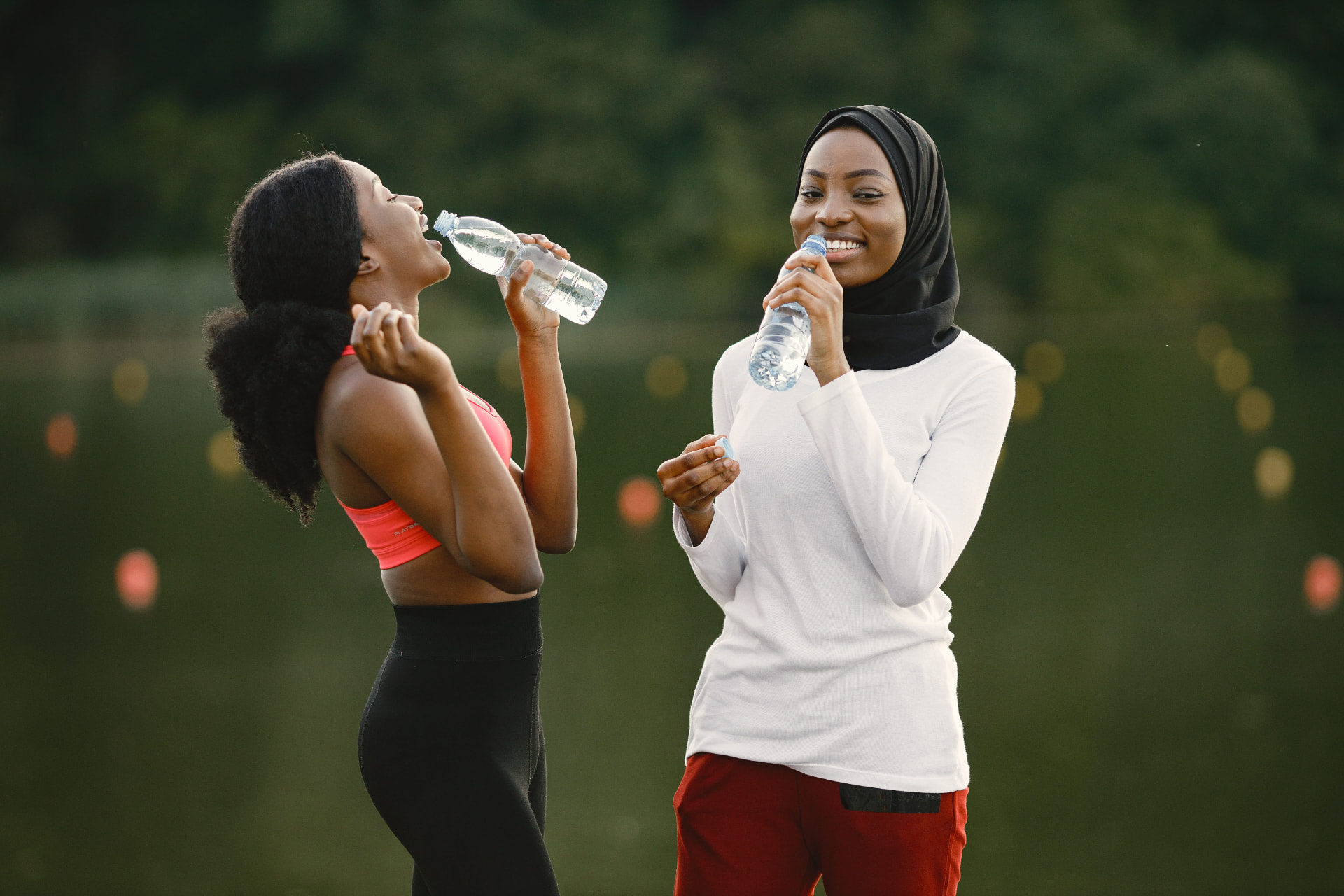 Community members sharing Sacred 7 hydration and wellness drinks